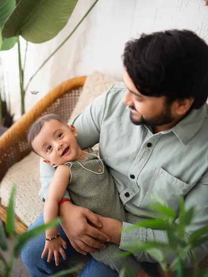 A happy baby boy enjoying some quality time with his dad.