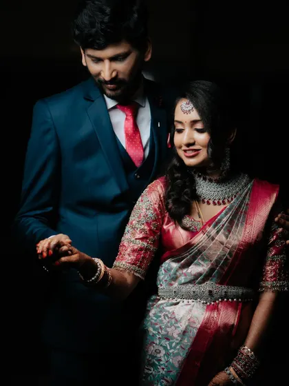 A classic, elegant portrait of the couple in their reception attire, their love shining through.