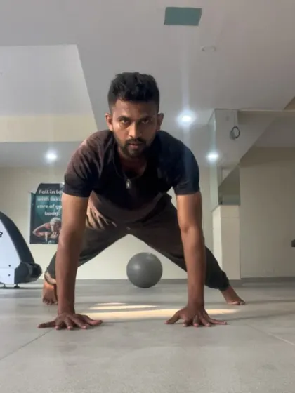 Returning to the wide pushup position, ready for another repetition. Consistency and discipline are the path to greatness.