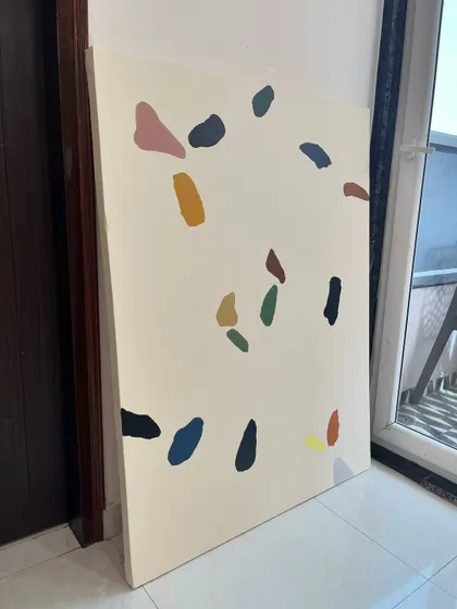 The terrazzo-style painting in my studio. The simplicity of the design makes it a versatile piece that can work with many different decor styles.