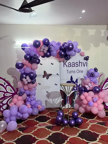 The complete butterfly-themed stage setup, ready for a memorable first birthday celebration.