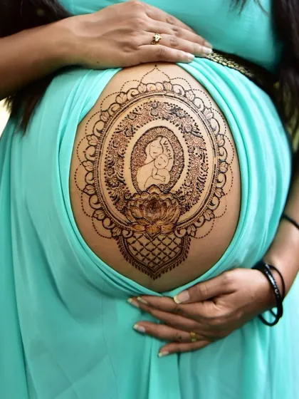 A special blessing for the mom to be. This pregnancy belly henna features a mother and child silhouette inside an intricate mandala frame, created with my all natural, organic paste that is completely safe for you and your baby.