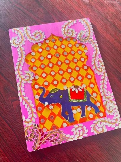 Another view of the beautiful pink elephant Lippan art piece.