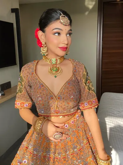 Makeup and sunlight are a match made in heaven. This bride's skin is glowing, and the classic red lip looks even more vibrant in the natural light.