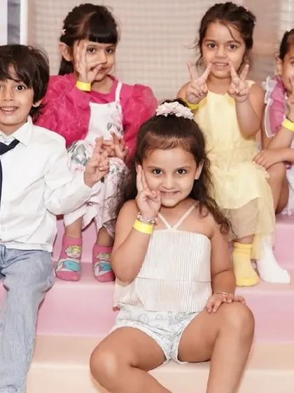 A group of happy kids posing for the camera.