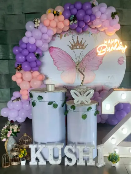 A royal Butterfly theme for a 2nd birthday, featuring a crown on the butterfly graphic, marquee number, and personalized light-up name.