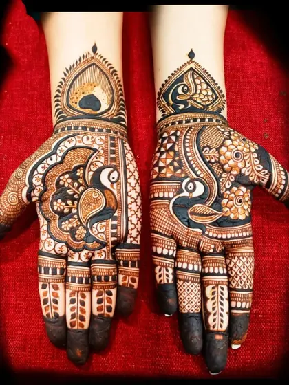 A beautiful peacock design for the palms, with intricate details on the feathers and delicate finger work.
