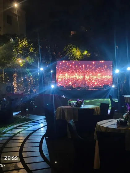 The stage and seating area for an outdoor Diwali event, lit up for the evening festivities.