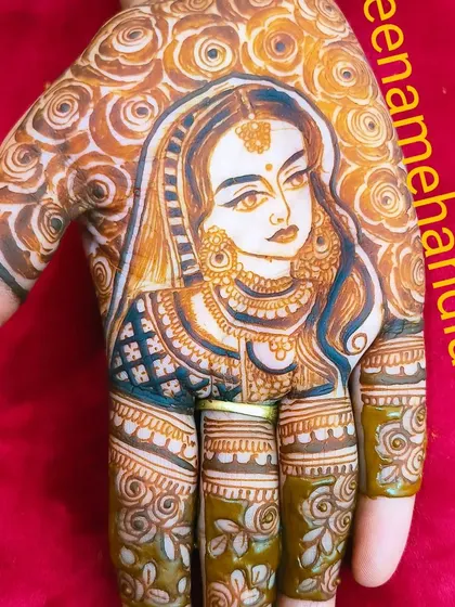 This bride portrait is surrounded by a background of roses. It's a beautiful way to combine a personal portrait with classic floral mehandi patterns.