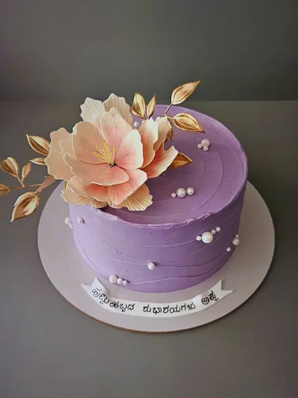 Handmade peonies have an aura of their own. This pineapple cream cake for a dad's birthday is adorned with a beautiful, handcrafted sugar peony.