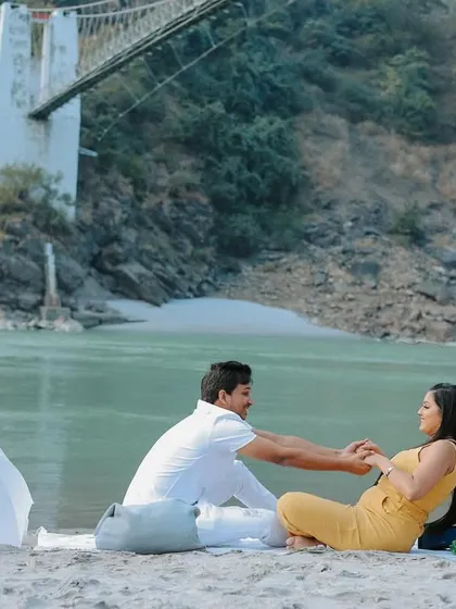 A romantic picnic setup on the banks of the Ganges in Rishikesh. I help couples plan these unique concepts to make their pre-wedding shoot personal and memorable.