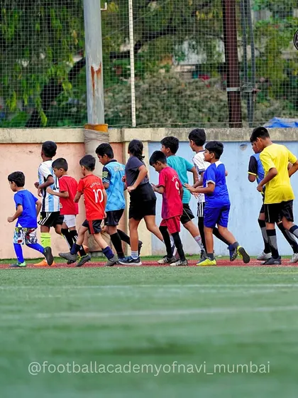 A group of players jogs together during a warm-up. I emphasize proper warm-ups and cool-downs to ensure my players are physically prepared and avoid injury.