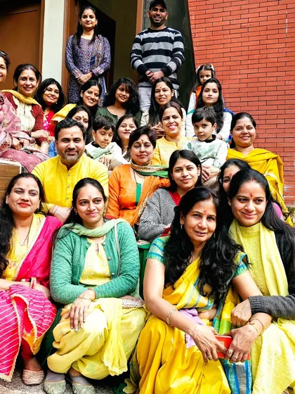 A large group photo of our 'yog parivar' celebrating Basant Panchami. The joy and sense of belonging are what make our community special.