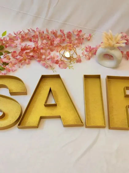 I love creating things that are both beautiful and useful. These large monogram letter trays, spelling out the name 'SAIF', are perfect for stylishly packing wedding favours or dry fruits for your guests.