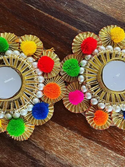 Another look at our pompom tea light holders, showing the variety of colors we use. We love creating pieces that are full of joy and celebration.