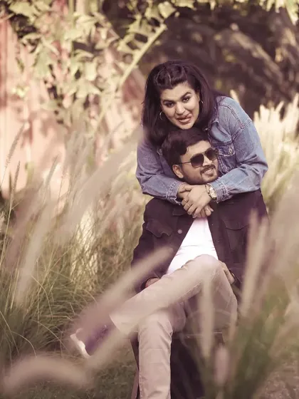 An affectionate embrace captured during a pre-wedding session in a beautiful outdoor location.