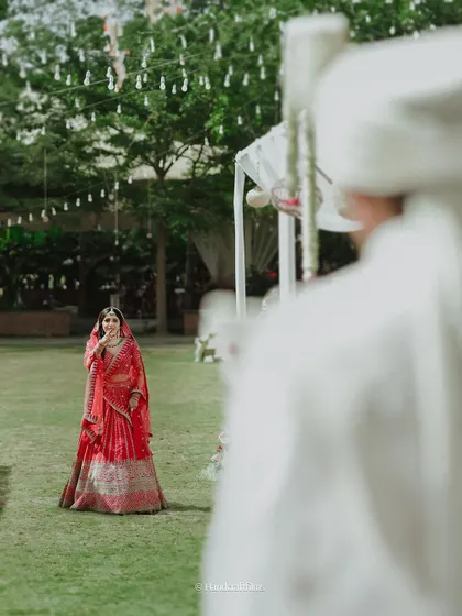 The bride's grand entrance is a moment to remember. We ensure the decor, like this beautiful outdoor aisle, perfectly frames her walk towards a new beginning.