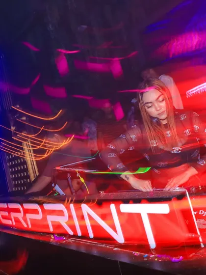 A long-exposure shot capturing the motion and energy of me mixing at Fingerprint.