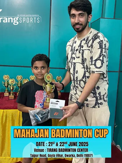 This young champion from the Mahajan Badminton Cup is all smiles with his well-deserved trophy and prize. We believe in rewarding hard work and dedication at every level.