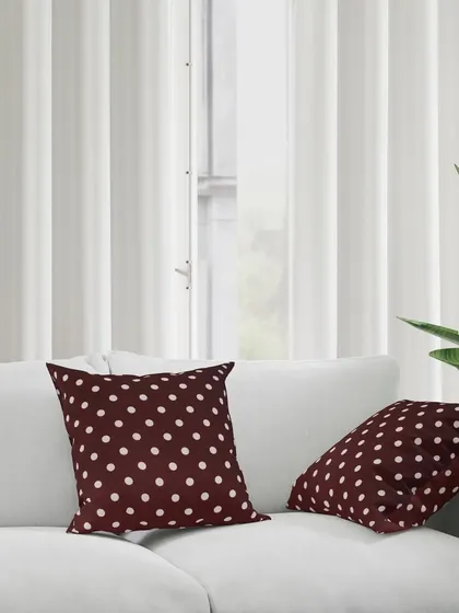 A lifestyle shot of our polka dot cushions on a sofa, creating a cozy and inviting home scene. We create aspirational images that sell a lifestyle, not just a product.