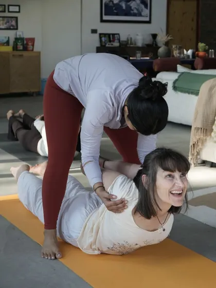 This is what my teaching is all about: supportive, hands-on guidance. I focus on helping you find proper alignment in a way that feels right for your body, ensuring you can practice safely and with confidence. The smile says it all.