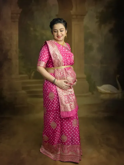 A simple and elegant portrait against a classic backdrop. The focus is entirely on you and the beautiful silhouette you create in this traditional saree.