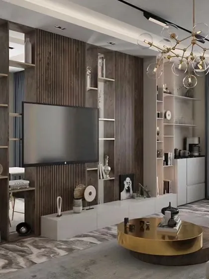 An open-plan living and dining area where a wooden slatted partition provides visual separation without closing off the space. The design uses a consistent color palette and a striking modern chandelier to unify the two zones.