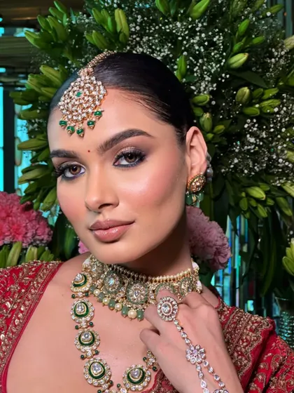 This shot highlights the hathphool (hand harness), an essential accessory for a complete traditional bridal look.