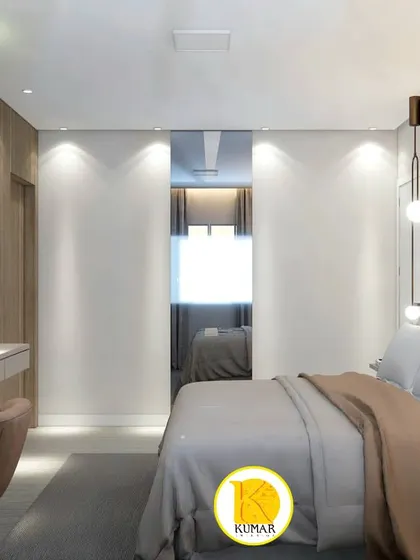 This bedroom features a large mirrored sliding wardrobe that visually doubles the space.