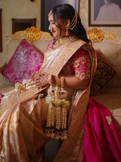 A side profile of the mother-to-be, showing how our floral kalire and hair accessories complement her traditional Maharashtrian look.