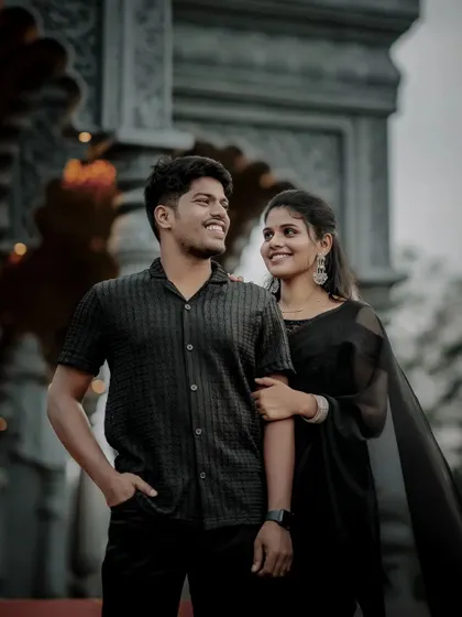 A candid and happy portrait of the couple, their smiles telling a story of love and excitement.