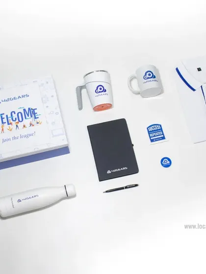 A bright and modern welcome kit designed to help new team members "Join the League." This set includes a custom box, a polo shirt, a water bottle, two types of mugs, a notebook, and branded pins.