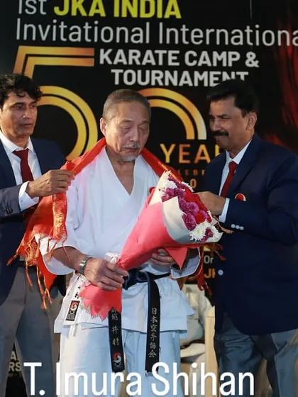 T. Imura Shihan, a senior instructor from JKA Headquarters, being honored at the international camp. The respect shown to our masters is a cornerstone of the martial arts spirit, or budo.