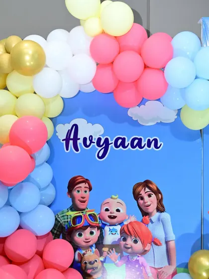 Another detail of the Cocomelon backdrop, showing the personalized name graphic.
