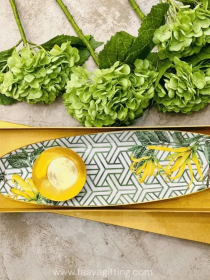 Our Borneo Botanical chip and dip set adds a touch of tropical charm to your home. The oval platter with a matching bowl is perfect for serving snacks and makes a wonderful gift for any occasion.