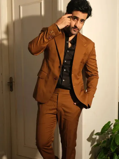 For Satyajeet Dubey, I designed this impeccably tailored brown formal suit. The silhouette is defined by a broad notch lapel and precise buttonhole detailing, showcasing the artistry in classic menswear.
