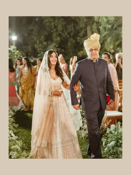 A touching moment as the bride walks down the aisle with her father. This photo captures the emotion and significance of this tradition.