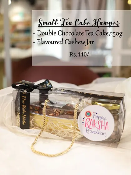 The Small Tea Cake Hamper is perfect for anyone who loves a good cake. It features our double chocolate tea cake along with a jar of flavored cashews, packed in a convenient and portable gift bag.