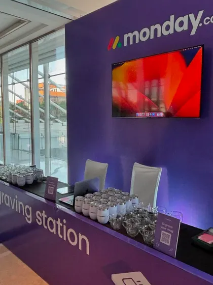 The complete engraving station set up for Monday.com. It's designed to be an attractive and engaging focal point at any corporate event, drawing guests in to see the personalization process live.