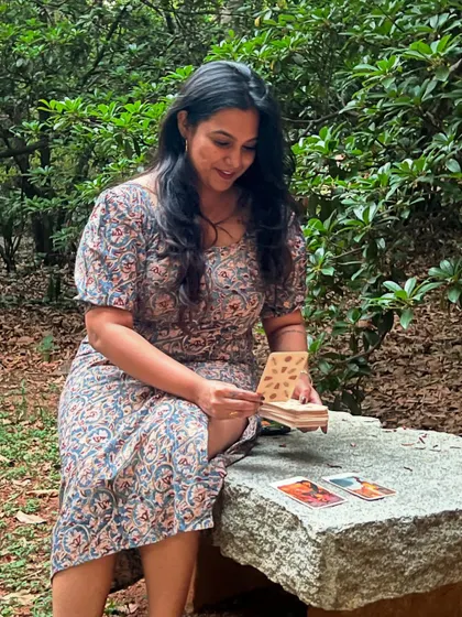 Another shot celebrating World Tarot Day. Here I am looking at the cards, fully absorbed in their story, surrounded by the peaceful energy of the outdoors.