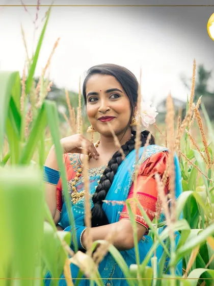 Taking the traditional look outdoors. This shot shows how well the makeup holds up in natural light, maintaining its vibrancy and flawless finish for an outdoor photoshoot.