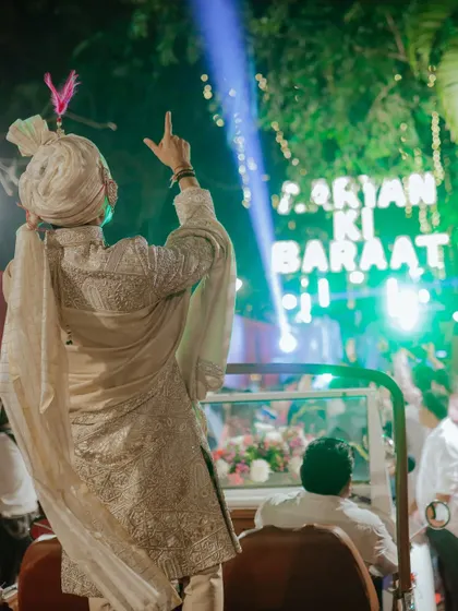 The groom, leading the party from his jeep. I coordinate with DJs and lighting teams to make the baraat feel like a moving concert.