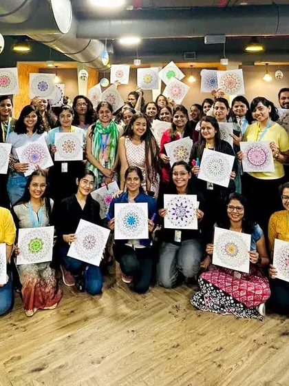 The joy and happiness in this photo say it all. A group of employees from a corporate client, rejuvenated after a session of connecting with their creative side.