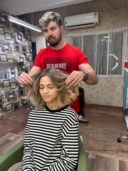 The beauty of blondes. This client's new look features a short, chic bob with a rooted blonde color, creating a modern and stylish vibe.