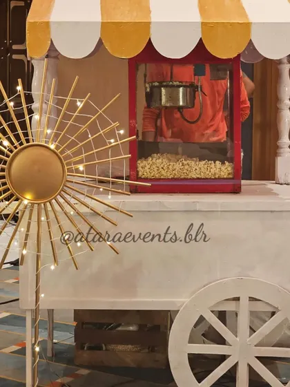 A popcorn cart at an Aqeeqah celebration. This adds a fun and interactive element for guests, especially the younger ones, and the cart is decorated to match the event's theme.