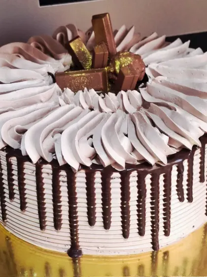 My loaded chocolate drip cake is a bestseller for a reason. This eggless truffle cake is covered in rich chocolate ganache and topped with favorites like KitKat and Ferrero Rocher, making it a dream come true for any chocolate lover.