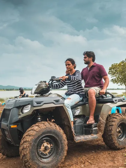 We cater to all skill levels, ensuring everyone feels comfortable and confident. Here, a team member enjoys a ride on our Polaris ATV, a great option for a stable and powerful off-road adventure.