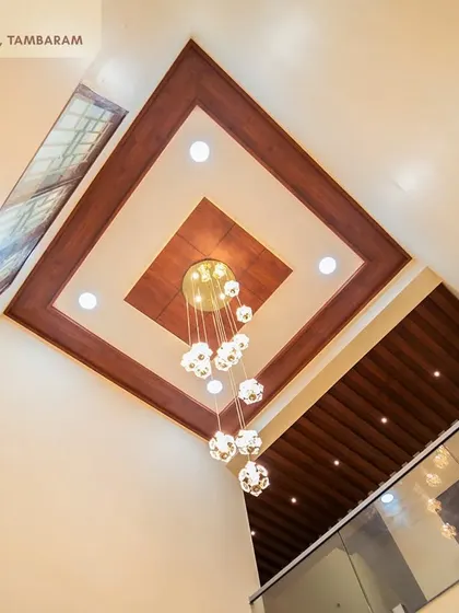 A duplicate image of the impressive double-height ceiling and chandelier in the Tambaram villa.