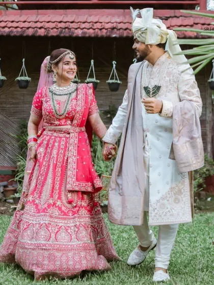 Another happy couple from our client diaries. The bride looks absolutely stunning in her pink rental lehenga, creating a beautiful memory.