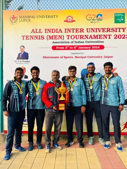 The victorious university team, with our player Oges, after winning the All India Inter-University tennis tournament.